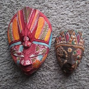 Two colorful carved wood batik masks